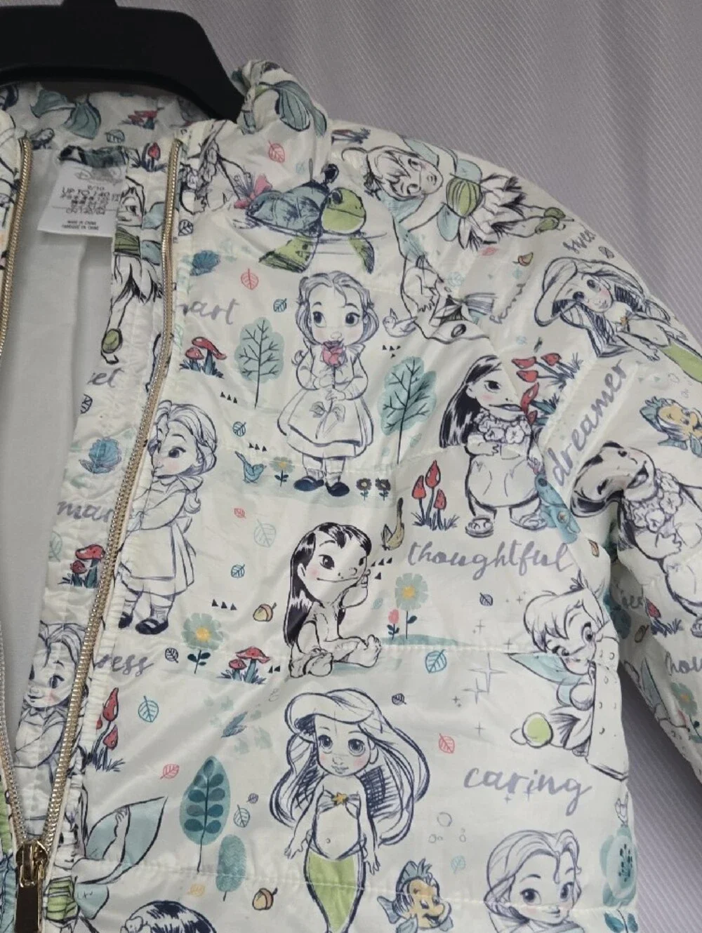 Disney Quilted Puffer Jacket with Cream Background and Pastel Accents